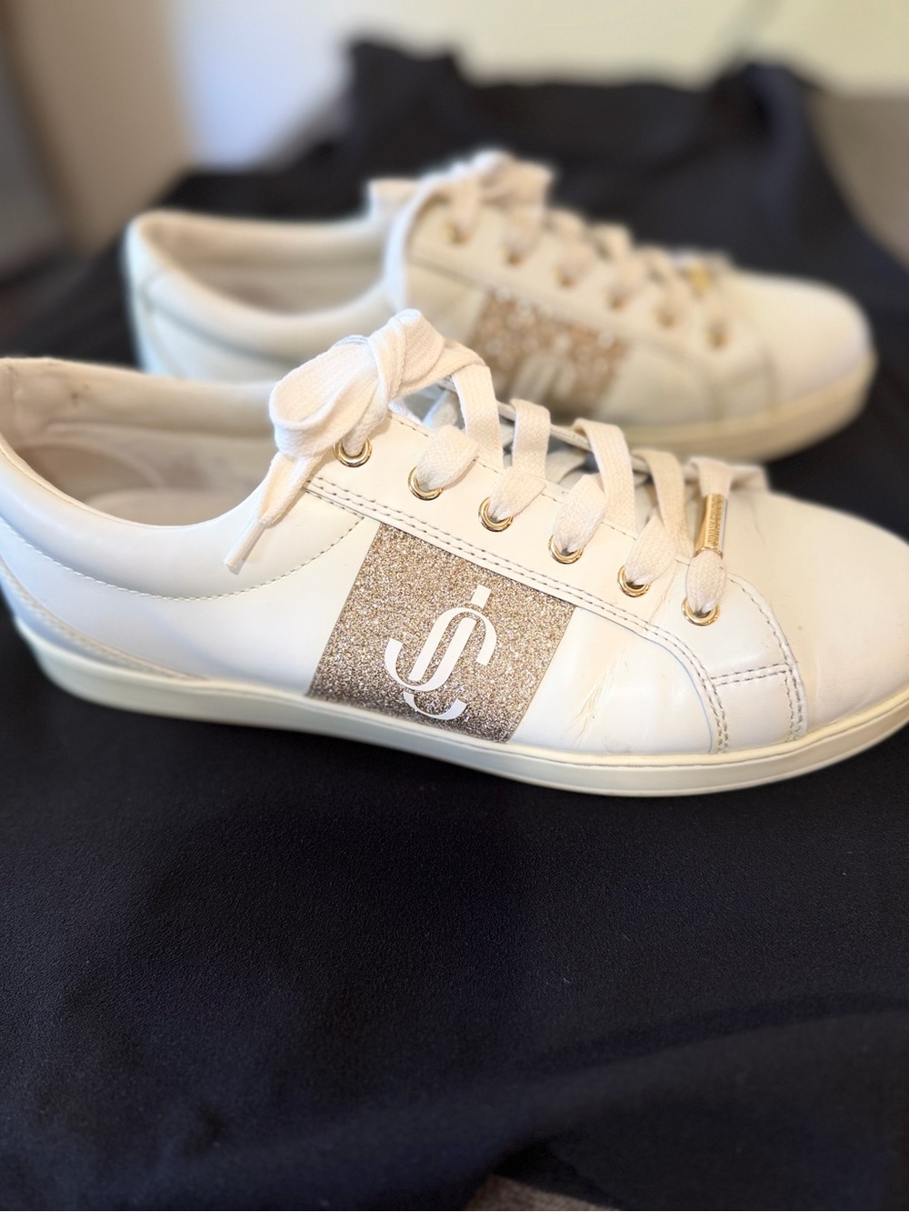 Jimmy Choo Women’s White Sneakers with Gold Glitter Accent